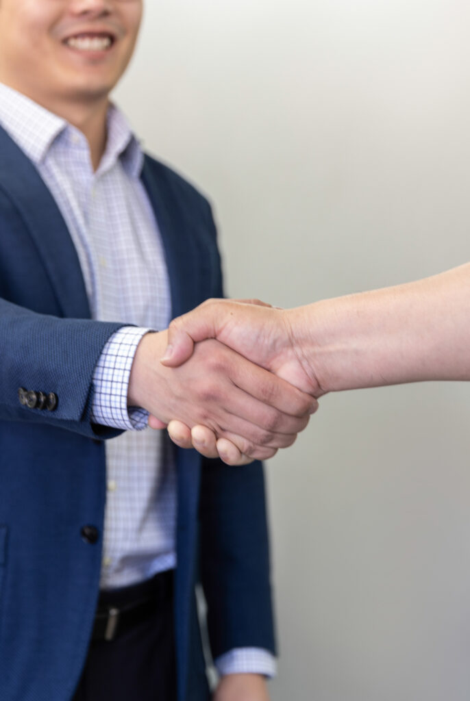 property manager shaking hands with a tenant
