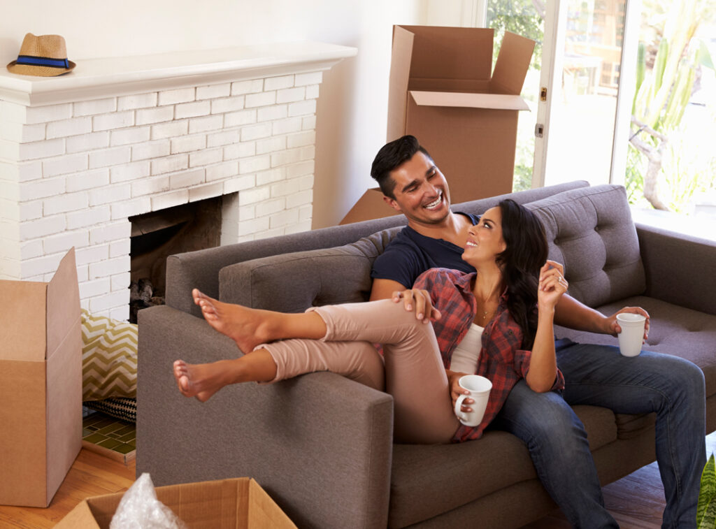couple smiling and relaxed in their home